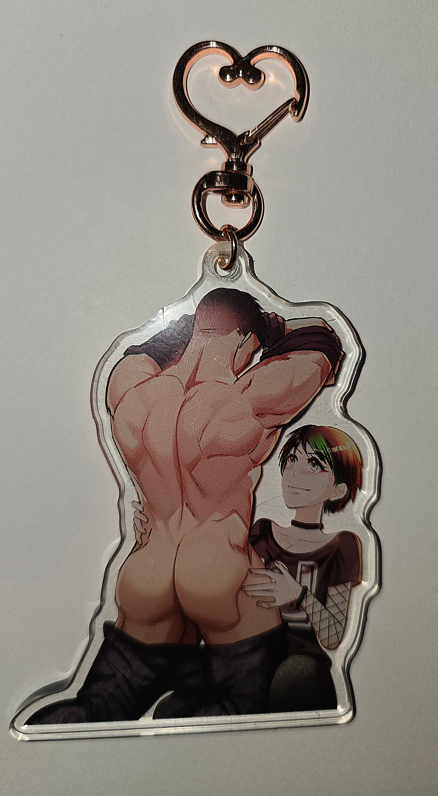 Anime acrylic keychain featuring tomboyish goth punk rock girl with buff bara jock in role-reversal romance design by masdemon